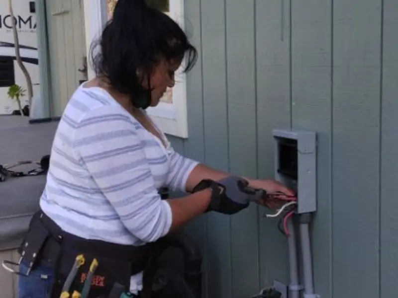 Licensed electrician wiring an exterior subpanel in Larose